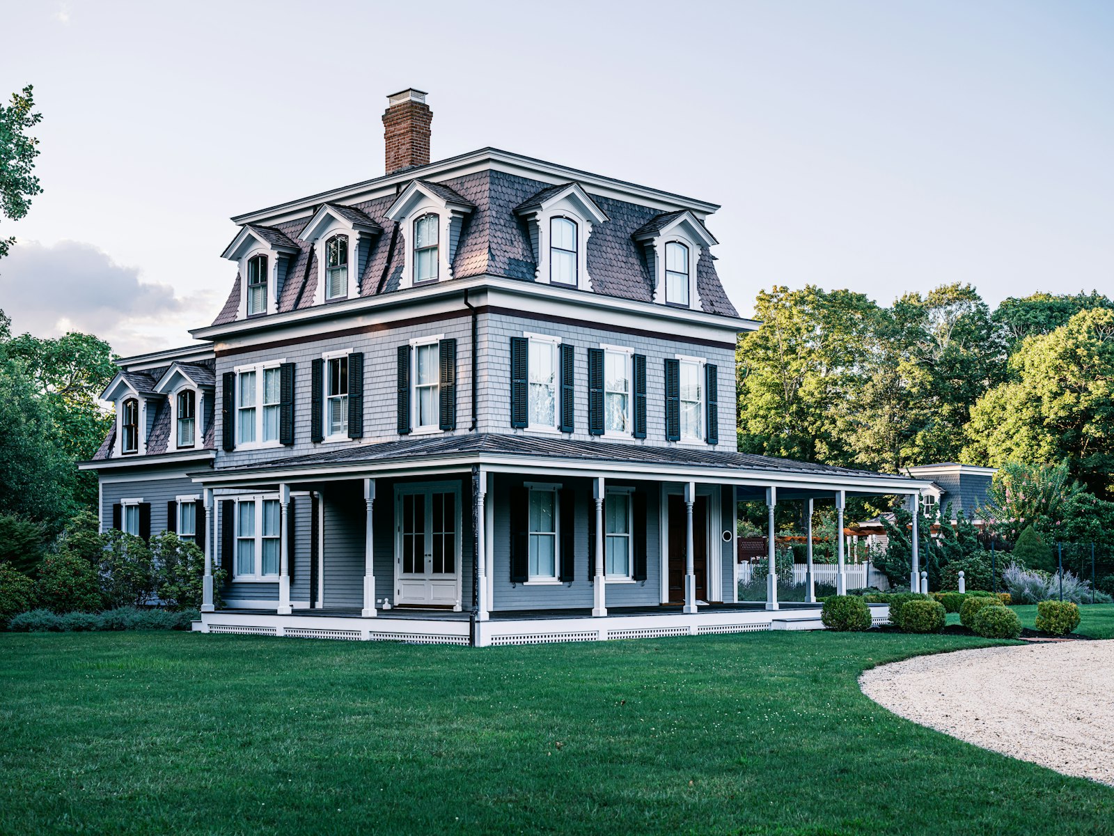 Elegant luxury estate facade with manicured grounds